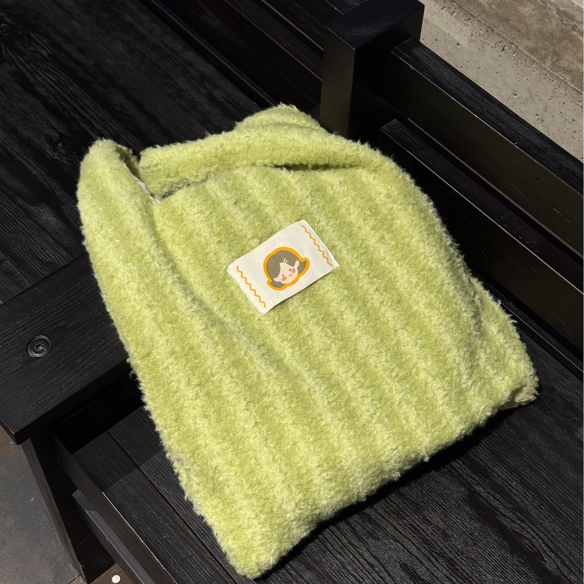 The Little Hue Green Striped Furry Designer Canvas Tote Bag is a perfect blend of playful charm and bold style, inspired by Little Hue’s colorful, confident personality. The vibrant green stripes evoke freshness, growth, and a sense of adventure, while the soft, furry texture adds a touch of luxury and fun.